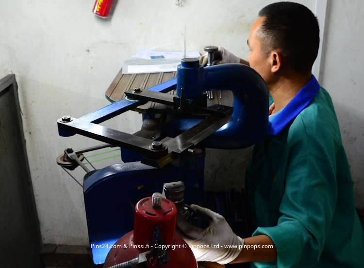 Manufacturing lapel pins in an audited factory